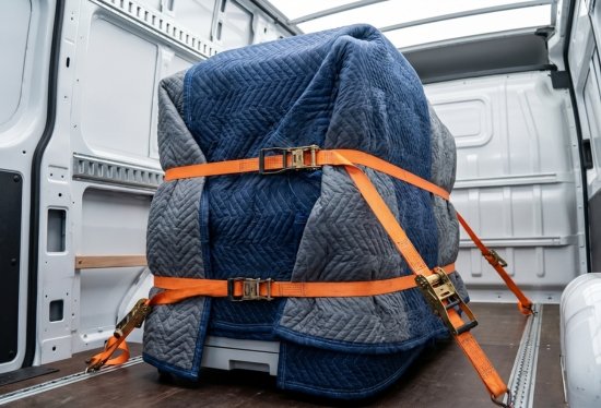Securely strapping and protecting valuable office and IT equipment inside a professional transport van.